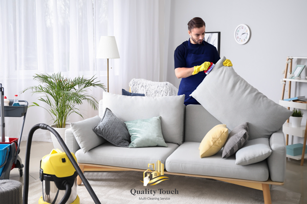 Quality Touch cleaner organizing cushions in a bright, modern living room.